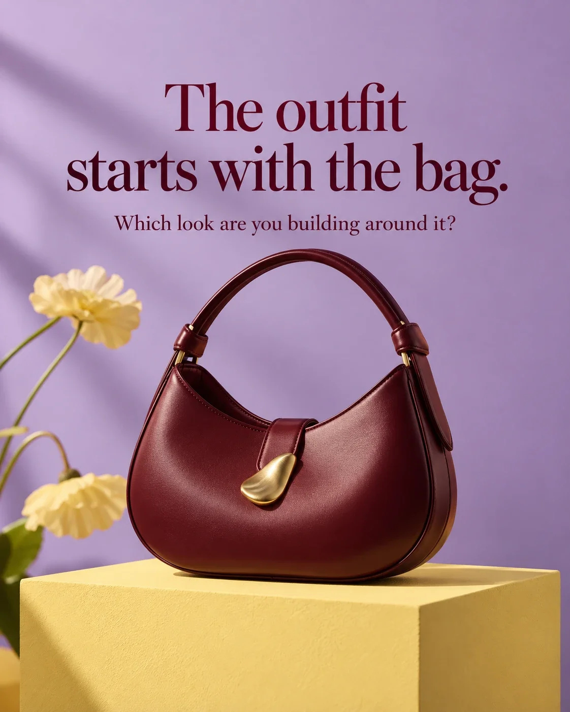 Sculptural burgundy designer shoulder bag with the outfit starts with the bag headline